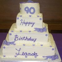 90Th Birthday First Buttercream stacked cake. There are 8 layers of white cake, with all buttercream, in between and on cake.