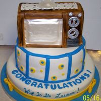 Graduation With Television On Top The grad requested a fifties style television on top of her graduationcake, so I delivered. It's a white cake with fondant covering,...