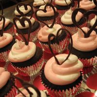 Happy Valentine's Day! Same concept as the music notes with the piped dark chocolate hearts. I put vanilla frosting in a small pastry bag, then the strawberry in...