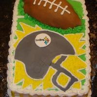 Steelers Football Cake Chocolate cake with buttercream icing and fondant accents.