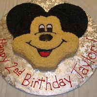 Mickey Mouse Birthday Cake Buttercream icing. 9" round and two 6" rounds. Found the idea on here since Wilton doesn't make the Mickey pan right now.