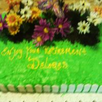 Retired To The Garden Yellow sheet cake brushed with lemon simple suryup, decorated with buttercream frosting tinted green to represent grass. Silk flowers,...