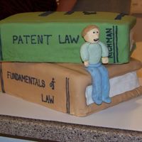 Law School Graduation I made this cake for my brother's law school graduation. Cakes were carved and covered with MMF. Figure is made out of gumpaste--I...