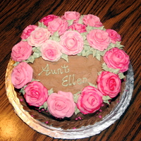Birthday Cake A 8 inch cake covered in choc. buttercream. The rose colors were created with striping the pastry bag.