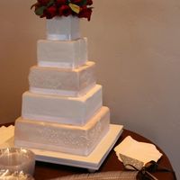 Rosanna This was my first square, fondant covered cake for my sister's wedding reception back in April. 12", 10", 8", 6"...