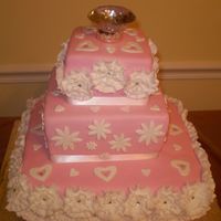 Nicole's Engagement Cake 6, 8 and 12 square cakes covered in fondant with fondant gumpaste flowers. Topper is a "diamond" gem that I found in craft store...