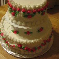 2 Layer Stacked Cake This is a white cake, with pink borders and pink flowers. I took a class to show me how to decorate while stacking or using pillars. I was...