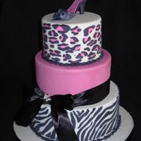 Animal Print Dummies for a display at an auction. Fondant with royal stenciling. Gumpaste shoe. Real ribbon - didn't want to make black fondant!