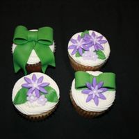 Purple And Green Cuppies For a baby shower. BC icing, fondant accents