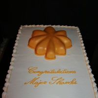 Military Promotion Promotion to Major. Leaf is carved from a round and covered w/ fondant, brushed with gold dust.