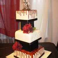 Gothic Wedding Designed by the bride. She wanted dripping blood that was dark red, and a monogram with "bling". Fondant with piping gel "...