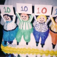 Adult 40Th Birthday Cake The little men are individual cakes in buttercream frosting. The cake is covered in rolled fondant.