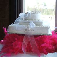 Tiara Cake This was a practice cake for a very small bridal show. These are actual tiaras placed on the cake and I put a hot pink boa under for...