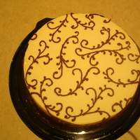 Cream And Brown Cake An 8" cake I made for an auction, all buttercream. Inspiration came from CC decorators. Thanks for looking.