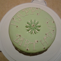 Green Birthday Cake Made for my Mother. First time using MMF. I tried using a paisley impression mat but the pattern didn't turn out properly.