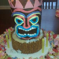 Tiki God made for my daughter's 12th birthday. Tiki is chocolate buttercream with fondant accents. Bottom tier is buttercream with pretzel...