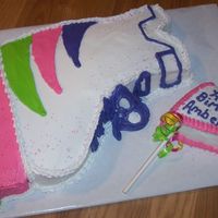 Skate Rollerblade skate cake cut from a 9 x 13 cake and used mini cupcakes for the wheels. Colors were requested by the birthday girl.