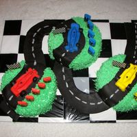 Race Cars I made these cakes for a set of twins and their three year old brother who were all celebrating their birthdays together. The cars are mmf...