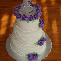 First Wedding Cake First wedding cake, first attempt at fondant roses, first attempt a quilting! Overall, happy with the result but I know it's filled...
