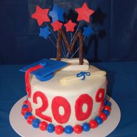 High School Graduation Cake to celebrate my daughter's high school graduation. All decorations are MM fondant - and my first attempt to cover an entire cake...