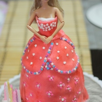Barbie Cake barbie dress is the cake, covered with fondant. star-shaped sprinkles used as accents.