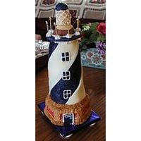 Cape Hatteras Lighthouse Inspired by a trip to the outterbanks of North Carolina. Mini basic white cakes coated with white and dark chocolate clay trimmed with...