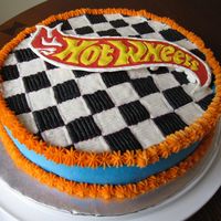 Hot Wheels Checkerboard 10" round cake, buttercream icing and checkerboard (took forever) and a royal icing color flow hot wheels logo.