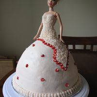 Barbie Bride With Red Flowers strawberry cake, strawberry buttercream icing, red royal icing drop flowers as accents