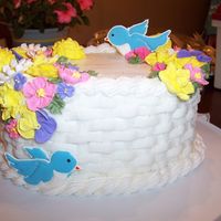 Wilton Course 2 Final Cake This is the standard Wilton course 2 final cake. royal icing flowers, color flow birds, oval cake, buttercream basketweave
