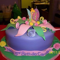 Tinkerbell 10" covered in fondant. Leaves & flowers made of fondant