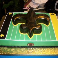 Saints Cake Sheet cake with an airbrushed fleur de lis on top.