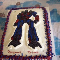 Optimus Prime Birthday Cake For My Son... The candle had been removed when we took the picture...that's why there is a hole in the frosting at the top.