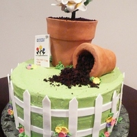 Garden Cake This was a very fun cake to make! Everything is edible except for the flower wires and the leaves, I made leaves but they didn't work...