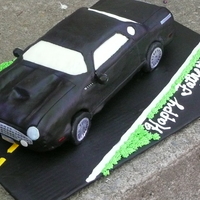 3D Thunderbird Car Two-layer white cake, carved and covered in black fondant. MMF windows, rice paper transfers for the details.