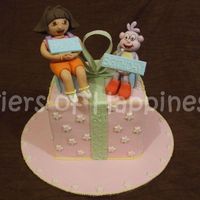 Dora And Boots fondant dora and boots on a fondant covered cake. vanilla cake with cookies and cream filling