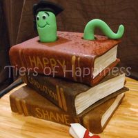 Book Worm Graduation stack of books cake,top and bottomcakechoc mud with middle cake oreo cake. all covered in fondant, book worm inspired by debbie brown'...