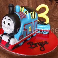 Thomas The Tank Engine choc mud carved to be thomas the tank engine.covered in fondant