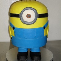 Minon Cake This cake started with 2 - 1" dowels screwed between 2 10" wooden circles. Rice crispy treats built around the 2 dowel rods...