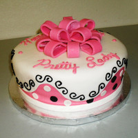 Pink Fondant Bow Cake 1 tier round cake iced in buttercream with a fondant overlay and bow on top.