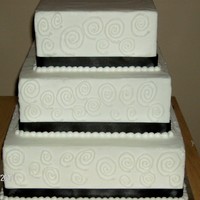 Anna 3 tier buttercream square step stacked black ribbon and circular scrolls