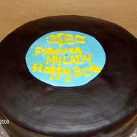 Record Birthday This is a 10" yellow cake, covered in black fondant made to resemble a vinyl record.