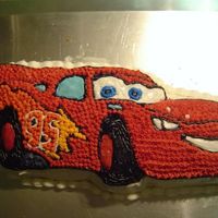 Colbys_9Th_Birthday.jpg I made this cake for our son's 9th birthday. He loves "Cars" and specifically asked for Lightning. I used the Wilton's...