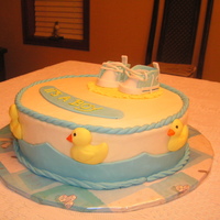 Baby Shower Cake White cake with lemon filling. Iced in buttercream. Accessories are made from fondant. TFL