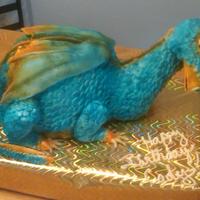 Blue Dragaon My co worked asked me to make a dragon cake for her son, she wanted it blue and orange... this is what I came up with... the dtragon in...