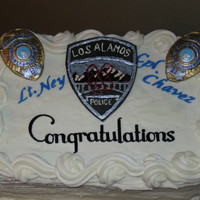 Retiring Police Officers Carrot Cake with Cream Cheese Frosting- Badges and Insignia are Painted Gum Paste.