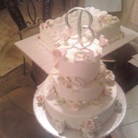 Mock Wedding Cake For Art Show Entry This is a Mock Wedding Cake, covered in fondant with fondant roses, to be shown at a local art show this weekend.