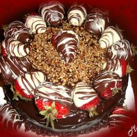Triple Threat Chocolate Chocolate cake,ganache filling & covering & chocolate covered strawberries & pecan pieces