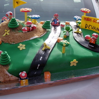 Super Mario Kart Birthday Cakes Super Mario Cake, every detail is edible except for the three little figures that the little boy got to keep.