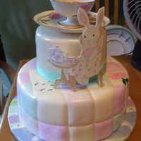 Sweet Lullabyes This cake is covered in fondant then DH (dear hubby) quilted the bottom tier with one of our tools to make it look like a comforter and he...