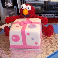 Elmo's Gift Elmo is made out of RKT with buttercreme using grass tip, this was delivered to chuck-e-cheese & they thought it was an actual stuffed...